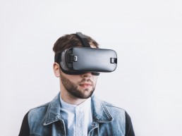 Bearded man wearing virtual reality headset
