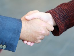 Close up of a man and woman shaking hands