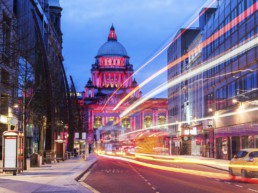 An illuminated Belfast City Hall and Donegall Place
