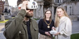 Innovators using virtual headsets with High Sheriff outside Belfast City Hall